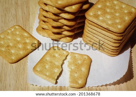 Stacks of square salty crackers. Cookies.