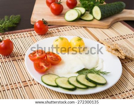 Breakfast - fried eggs (with raw frozen yolk) and vegetables