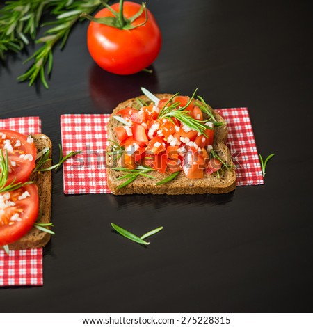 Healthy Foods. Vegetarian food. Sandwiches with vegetables. Italian Bruschetta. Bread with chopped tomatoes, garlic, rosemary.