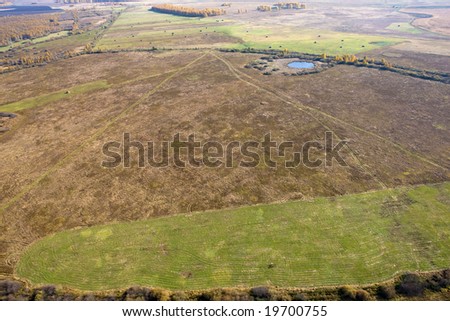 Aerial view of landscape of vast plains and forest in Siberia, Russian Federation.