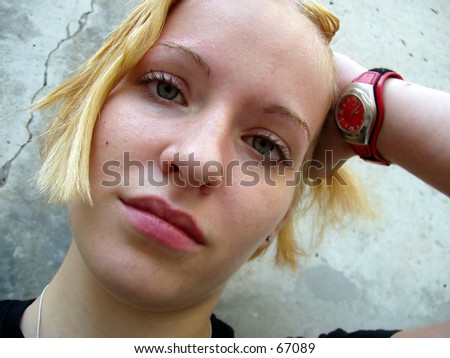 Very sharp shot of blonde girl (with slightly wet hair & face)  looking directly into the camera - excellent detail.