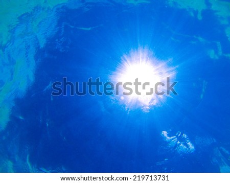 Sun with rays from the depths of the ocean