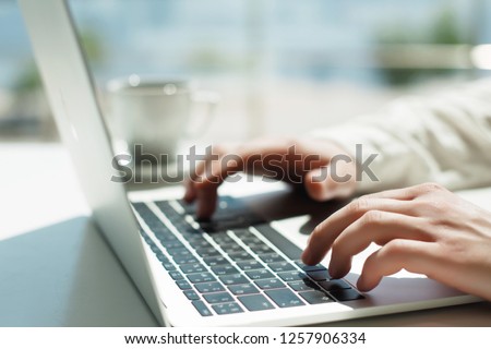 Businessman working laptop for new architectural project. Generic design notebook on the table. Young businessman working with laptop at office. Unrecognizable man using a modern portable computer
