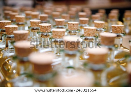Bottles or glass jars with cork. Row of glass storage jars with corks.