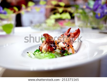 Image festive dinner plate or lobster lunch in restaurant floral arrangement. Modern food.