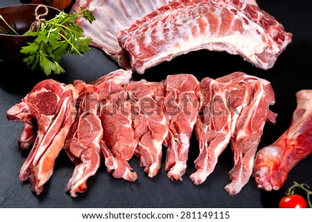 Fresh and raw meat. Ribs and pork chops uncooked, ready to grill and barbecue
