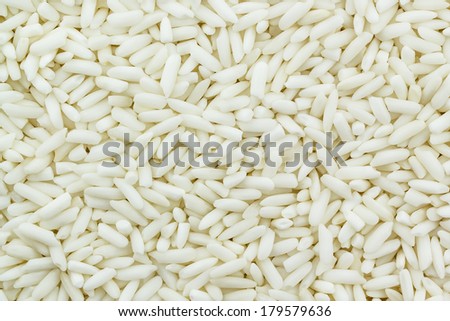 White sticky rice as a food background, Uncooked raw cereals, Macro closeup