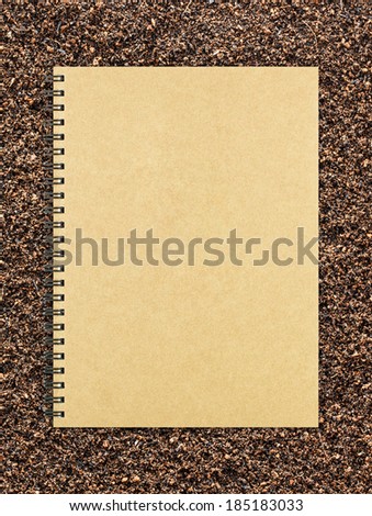 Blank realistic spiral notepad notebook on soil background