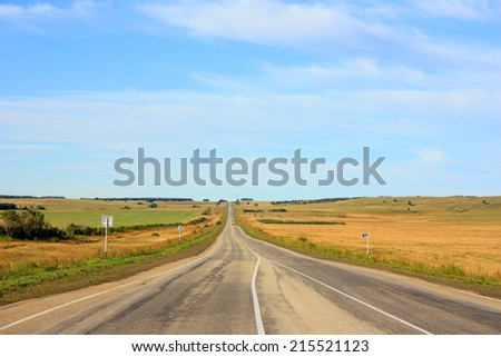 Asphalt road under blue sky