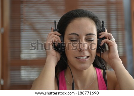 young zen woman listen to music with headphones