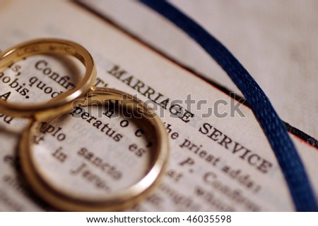 Wedding bands on bible before wedding ceremony.
