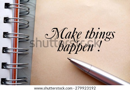 Make things happen text write on paper as background with pen and book