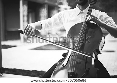 street musician playing on contrabass. black and white vintage