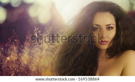 Beautiful woman on sunlight. Hair product and makeup product model