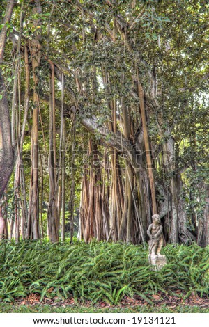 Concrete Statue in Banyan Tree Garden at Ringling Mansion in Sarasota, Florida. (The Banyan trees were a gift from Thomas Edison to John and Mable Ringling during the 1920\'s)
