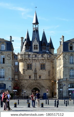 BORDEAUX, FRANCE, OCTOBER 18, 2013: Tourists walk in Porte Cailhau in Bordeaux, France