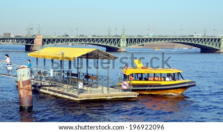 SAINT-PETERSBURG, RUSSIA, JUNE 5, 2014 -Â?Â? Aquabus sails away from the water station.  Kutuzov Embankment, St. Petersburg, Russia