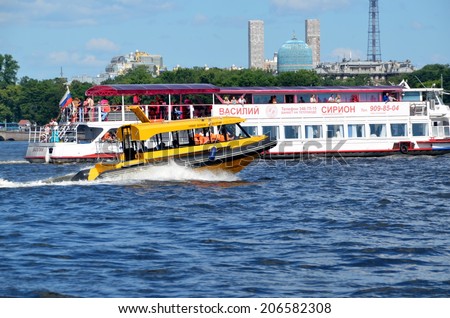 SAINT-PETERSBURG, RUSSIA, JULY 20, 2014: Aquabus overtakes excursion  boat  on the river Neva, St. Petersburg, Russia