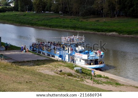 VOLOGDA, RUSSIA, AUGUST 16, 2014:  Excursion boat on Vologda river in Vologda city, Russia