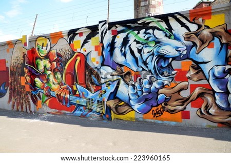 SAINT-PETERSBURG, RUSSIA, JULY 23, 2014: Bright graffiti on a brick wall in St. Petersburg, Russia