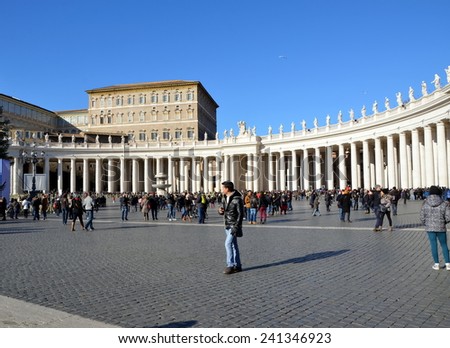 VATICAN CITY, VATICAN - DEC 29, 2014 - Tourists at Saint Peter\'s Square in Vatican City, Vatican. Saint Peter\'s Square is among most popular pilgrimage sites for Roman Catholics