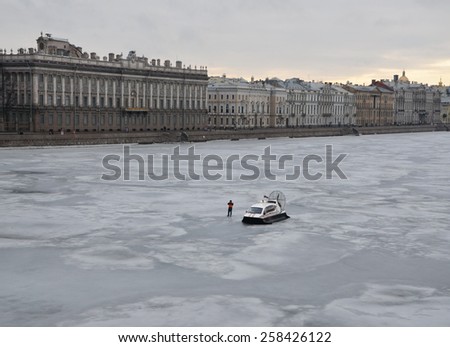 SAINT-PETERSBURG, RUSSIA, MARCH 1, 2015 - Emergency worker stands next to glisser on the Neva river. Action in memory of Boris Nemtsov on March 1, 2015