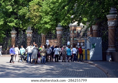 SAINT-PETERSBURG, RUSSIA - JUNE 10, 2015 - Tourists stand in line for tickets to Mikhailovsky Garden in Saint Petersburg, Russia