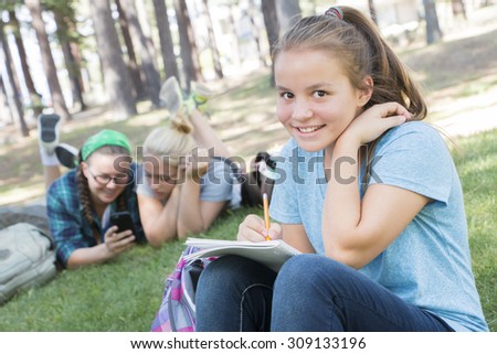 Young Girls Studying at the Park