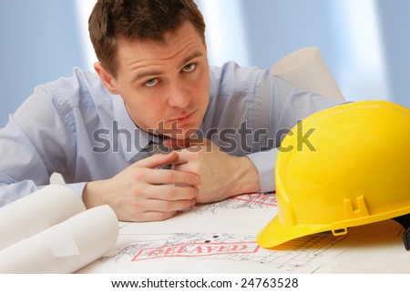 sad architect with delayed project because of crisis