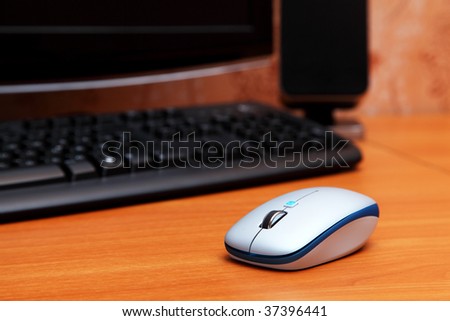 computer mouse on the wooden table
