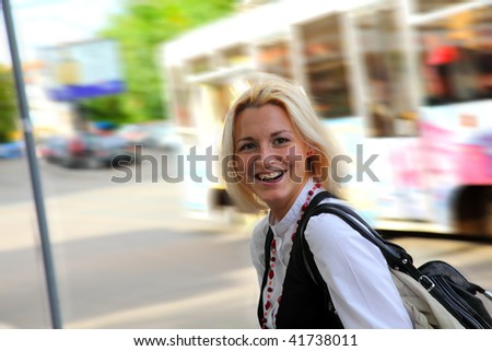 woman in motion in the street after shopping