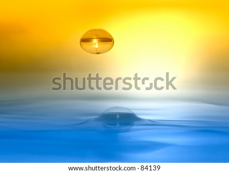 Water drop descending onto silky smooth water surface, duotone by filter