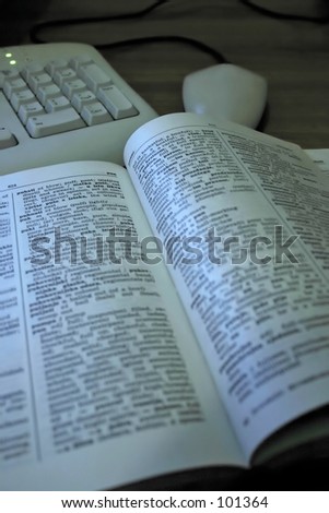 computer keyboard and mouse and croatian-english dictionary