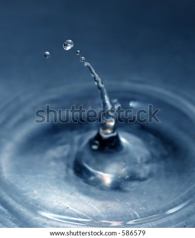 water drop caught in flight, extreme shallow depth-of-field