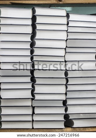 many new books on a wooden shelf