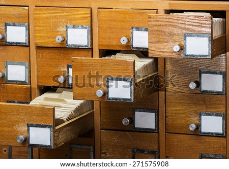 Open boxes in the old archive.  library card or file catalog.