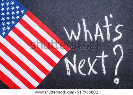 What\'s next on the chalk board and US flag. Election concept
