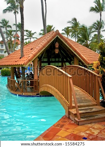 Small Hut That Is In The Middle Of A Large Swimming Pool On A Nice ...