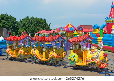 KIEV, UKRAINE - 7 June 2014: Colorful children attractions train. Amusement Park Kiev Ukraine. Photo Editorial Use Only.