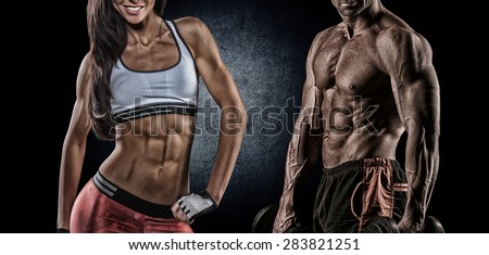 Fit woman and man showing her perfect abs