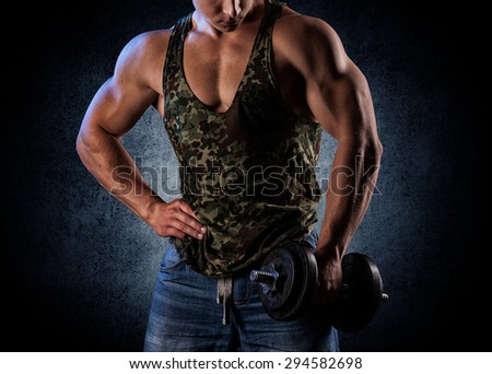 bodybuilder posing. Handsome power athletic guy male. Fitness muscular body