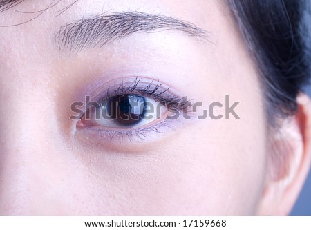 Big left eye of an elegant asian lady