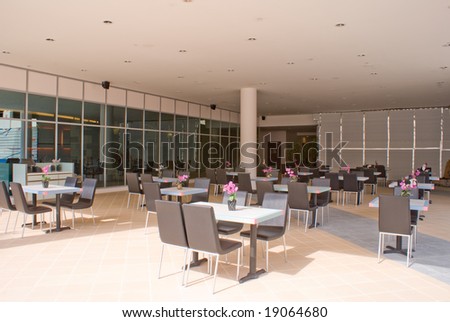 open western cafe and restaurant with wooden table and chair