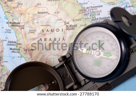 steel compass on travel map of Saudi Arabia