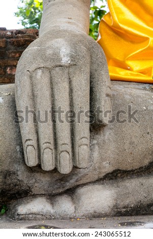 Buddha\'s right hand symbolizes the brand to life.
