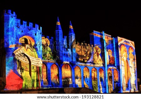 AVIGNON, FRANCE - NOVEMBER 29, 2013: The walls of the Popes Palace are illuminated during the light performance \