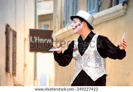 AVIGNON, FRANCE -? JULY 19, 2014: Actor on stilts advertising his performance during famous theatre festival from July 4 to 27, 2014 in Avignon, south of France.