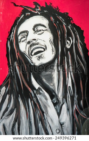 SETE, FRANCE  - SEPTEMBER 21, 2014: Graffiti portrait of Bob Marley, a famous Jamaican reggae singer-songwriter and guitarist on the wall of Sete, south of France.