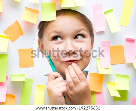 Cute girl with lots of reminder notes-school concept