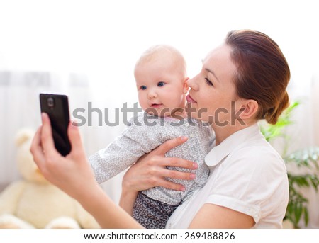 Mother holds cute baby